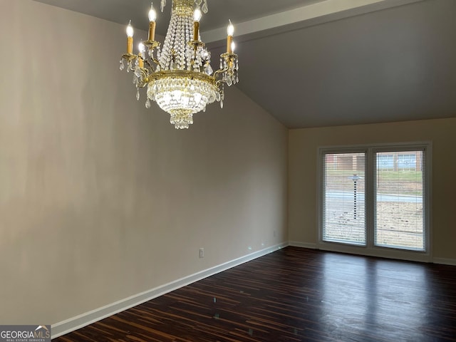 interior space with lofted ceiling, dark hardwood / wood-style floors, and a chandelier