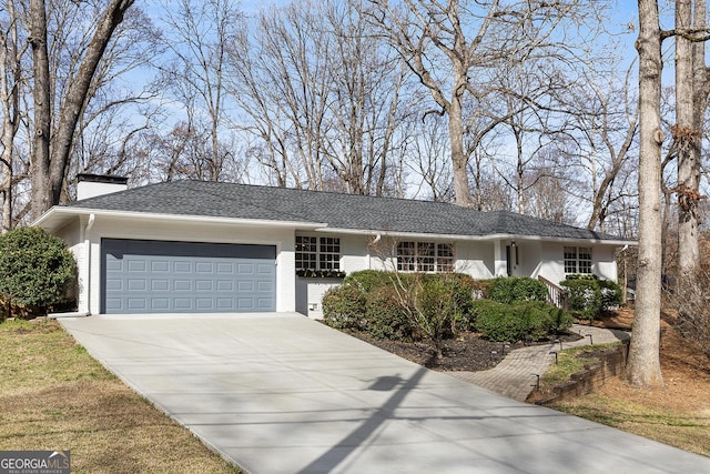 ranch-style home with a garage