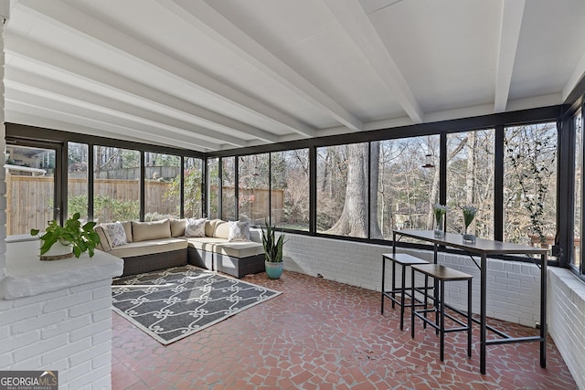 sunroom with beam ceiling