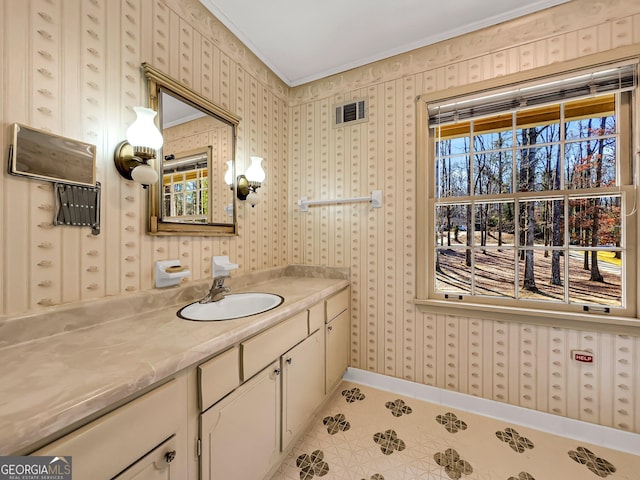 bathroom with vanity, tile patterned flooring, and ornamental molding