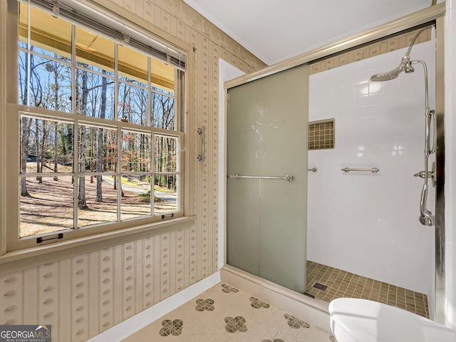 bathroom featuring a shower with shower door