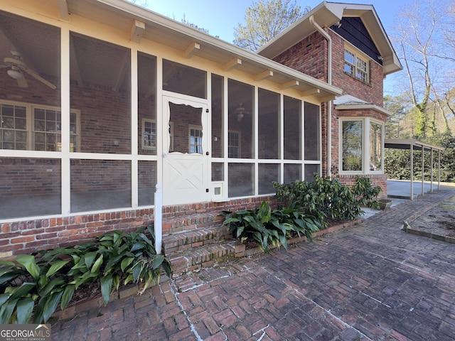 view of side of property with a sunroom