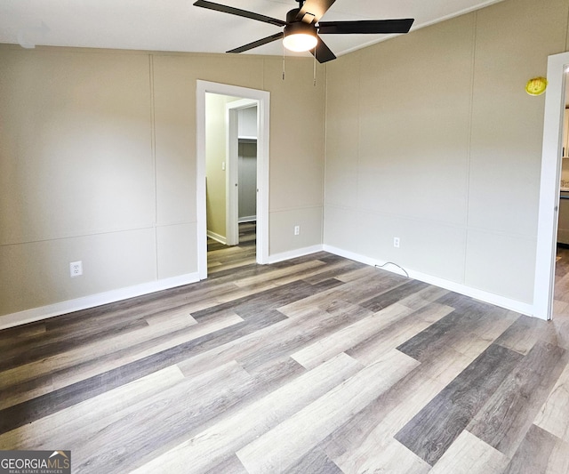 unfurnished room featuring ceiling fan and light hardwood / wood-style floors