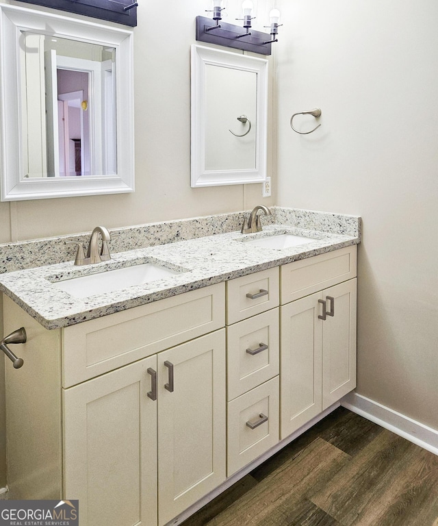 bathroom with vanity and hardwood / wood-style floors