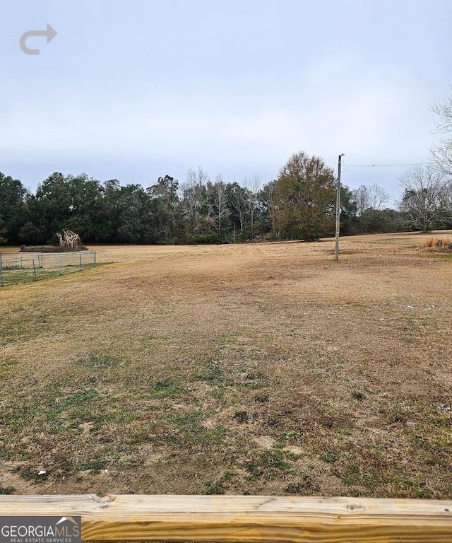 view of yard with a rural view