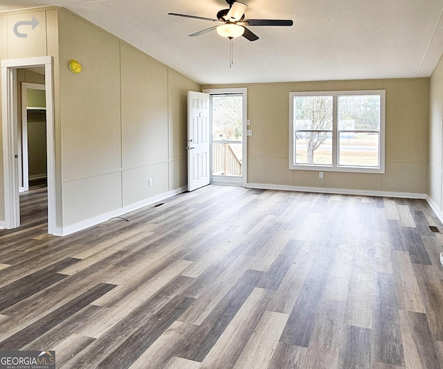 unfurnished room with hardwood / wood-style flooring and ceiling fan