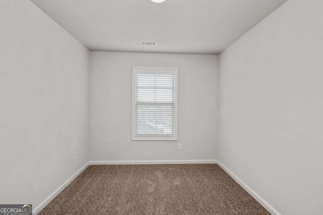 empty room featuring carpet flooring