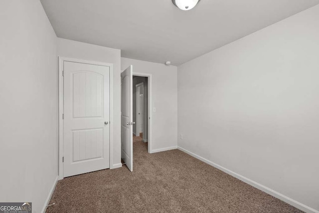 unfurnished bedroom featuring carpet