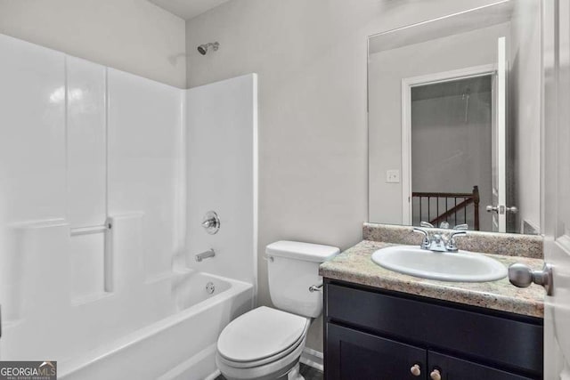 full bathroom featuring vanity,  shower combination, and toilet