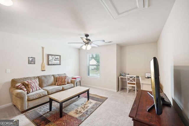 carpeted living room featuring ceiling fan