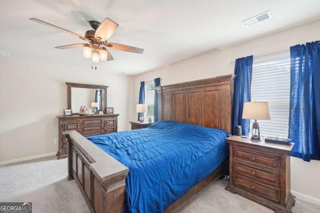 bedroom with light colored carpet and ceiling fan