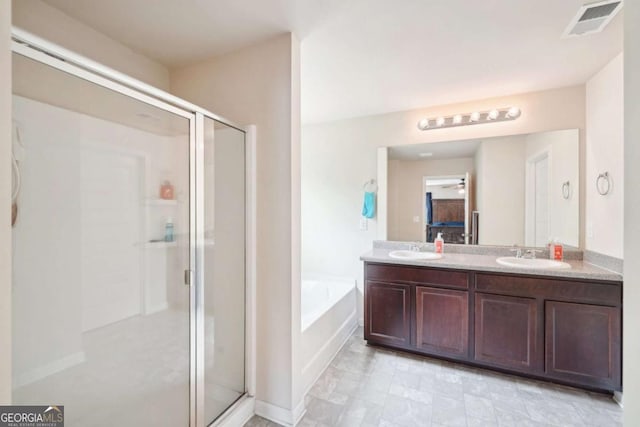 bathroom featuring shower with separate bathtub, vanity, and ceiling fan