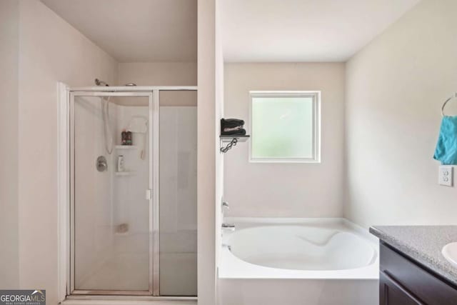 bathroom featuring vanity and plus walk in shower