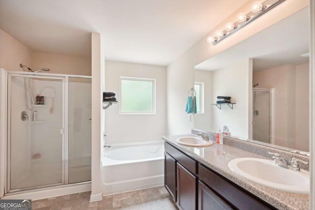 bathroom with vanity and separate shower and tub