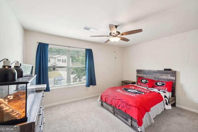 bedroom with light carpet and ceiling fan