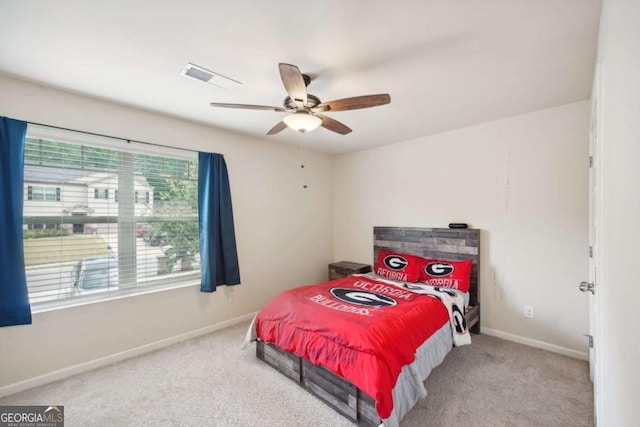 carpeted bedroom with ceiling fan