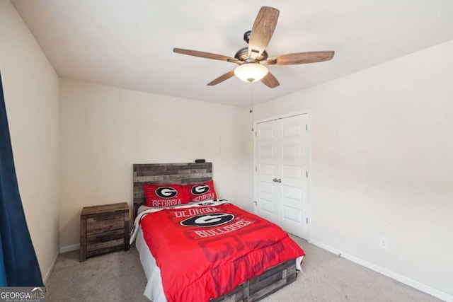 carpeted bedroom with ceiling fan