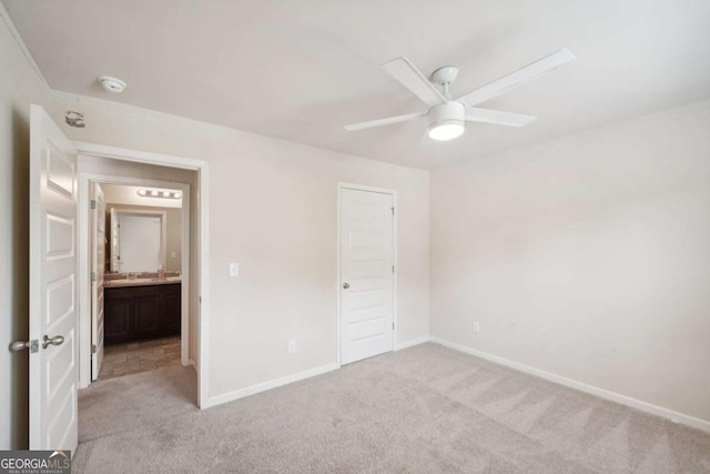 unfurnished bedroom featuring ceiling fan and light carpet