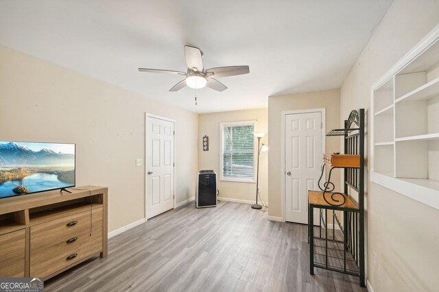 interior space featuring hardwood / wood-style floors and ceiling fan