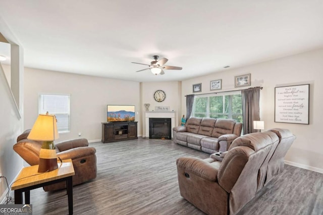 living room featuring hardwood / wood-style flooring and ceiling fan