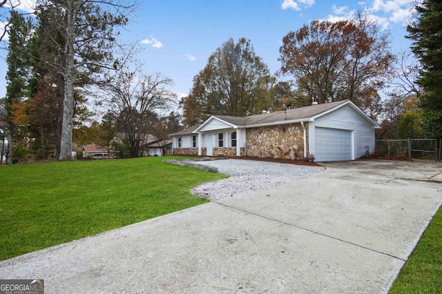 ranch-style home with a garage and a front yard