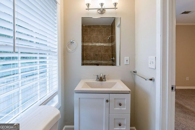 bathroom featuring vanity and a shower