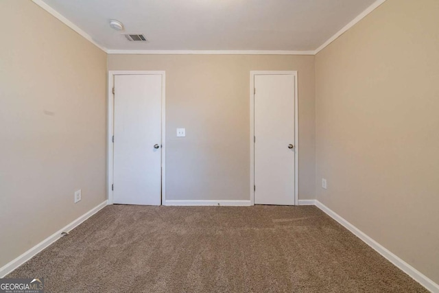 carpeted spare room with ornamental molding