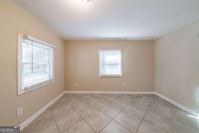 empty room featuring light tile patterned floors