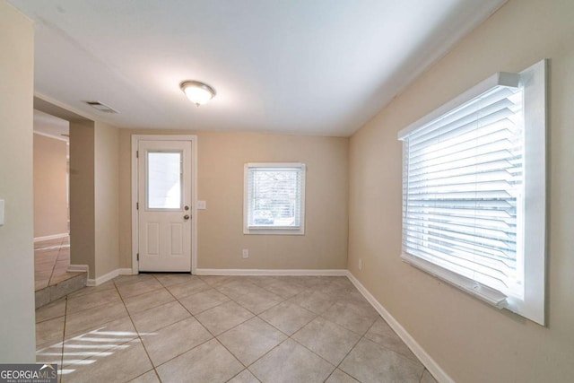 interior space featuring light tile patterned floors