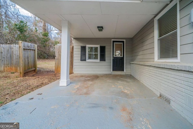 entrance to property featuring a patio area