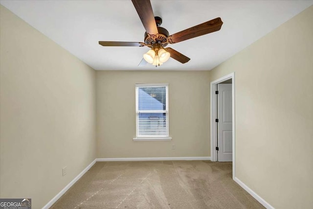 carpeted empty room with ceiling fan