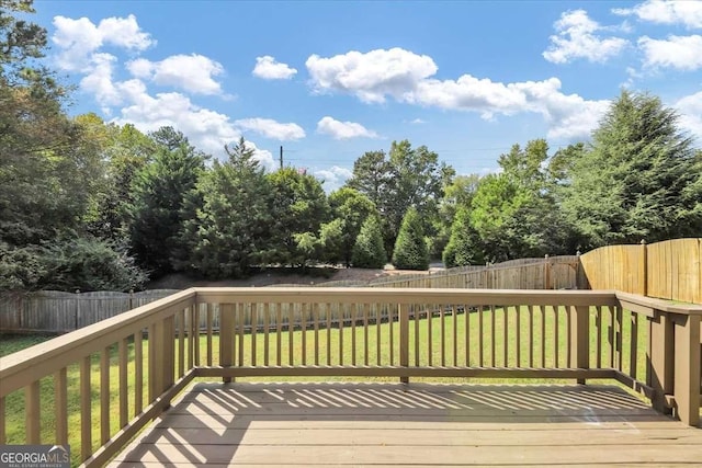 wooden terrace with a yard