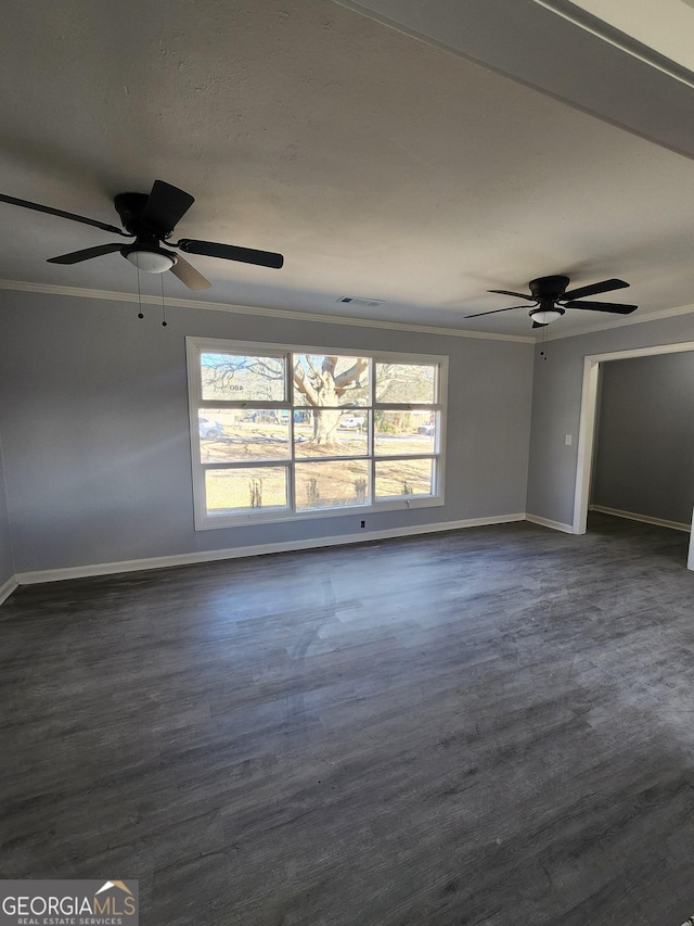 unfurnished room with ornamental molding, dark hardwood / wood-style floors, and ceiling fan