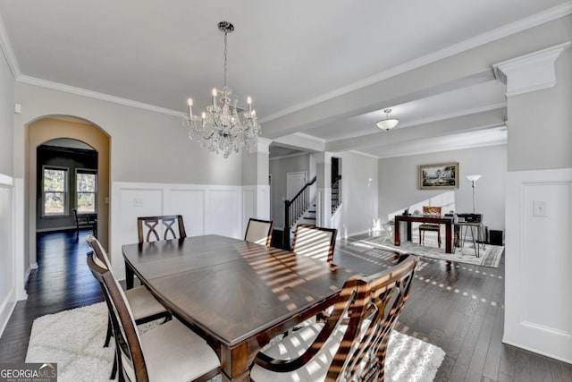 dining room featuring dark wood-type flooring and ornamental molding