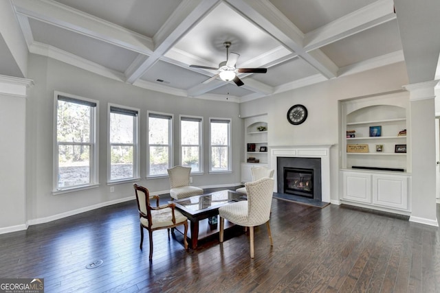 dining area featuring built in features, ceiling fan, beam ceiling, coffered ceiling, and dark hardwood / wood-style flooring