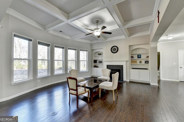 interior space with coffered ceiling, ceiling fan, dark hardwood / wood-style flooring, and beam ceiling