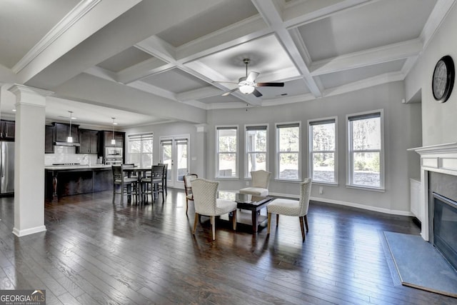 dining space with coffered ceiling, dark wood-type flooring, a high end fireplace, and decorative columns