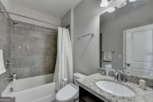 full bathroom with shower / bathtub combination with curtain, vanity, and toilet