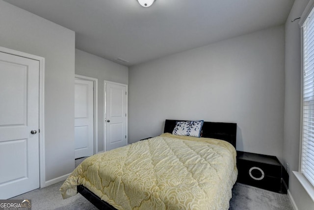 bedroom with light carpet