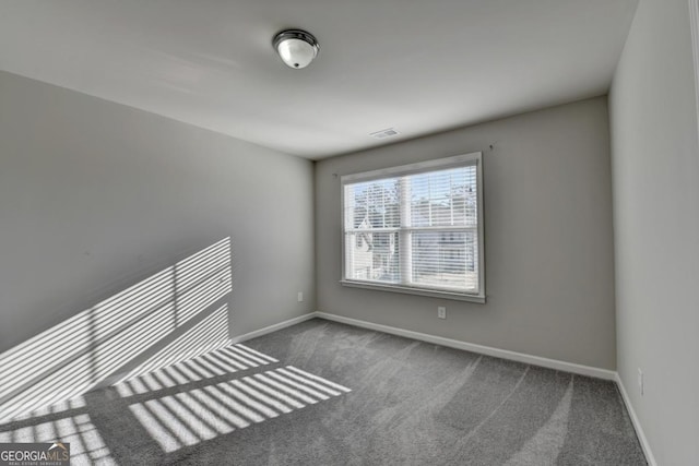 empty room featuring carpet floors