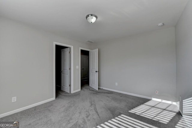 unfurnished bedroom with light colored carpet