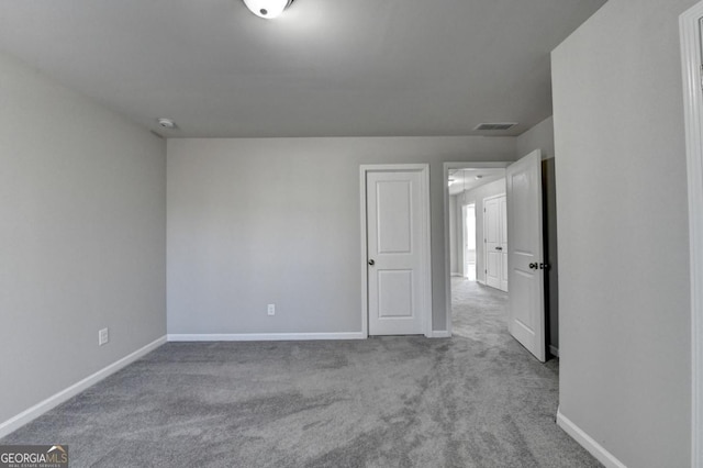 spare room featuring carpet floors