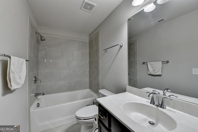 full bathroom with vanity, toilet, and tiled shower / bath combo