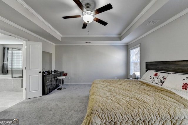 bedroom with a tray ceiling, ornamental molding, and light colored carpet