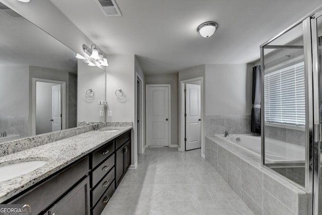 bathroom featuring vanity, separate shower and tub, and tile patterned floors