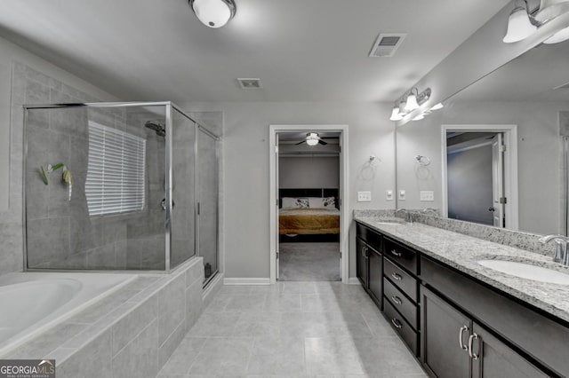 bathroom with walk in shower, ceiling fan, and vanity