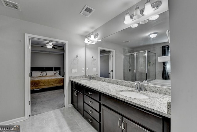 bathroom with vanity, a shower with shower door, tile patterned floors, and ceiling fan