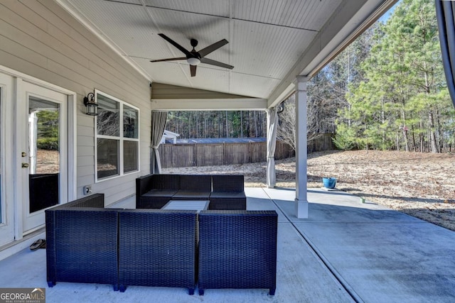 view of patio / terrace with ceiling fan and an outdoor living space