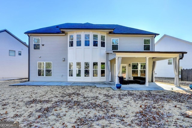 rear view of house featuring a patio