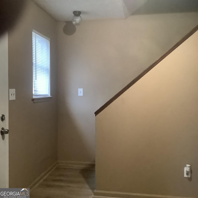 staircase featuring hardwood / wood-style floors